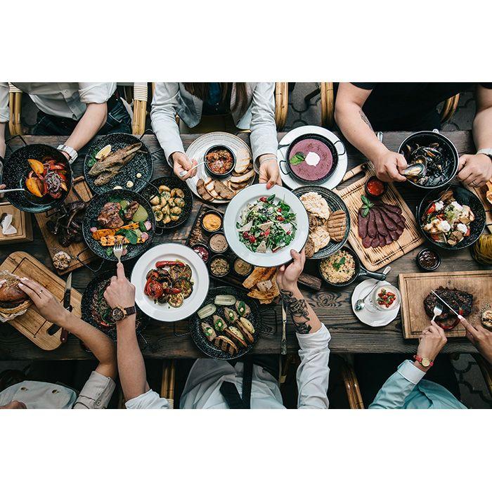 A long table of BBQ platters seen from above
