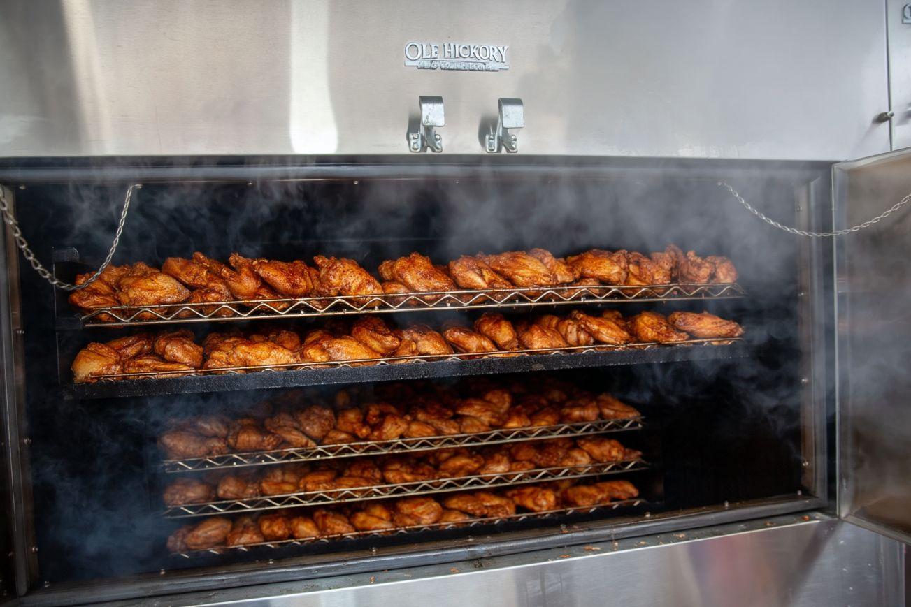 Half chickens on the smoker racks